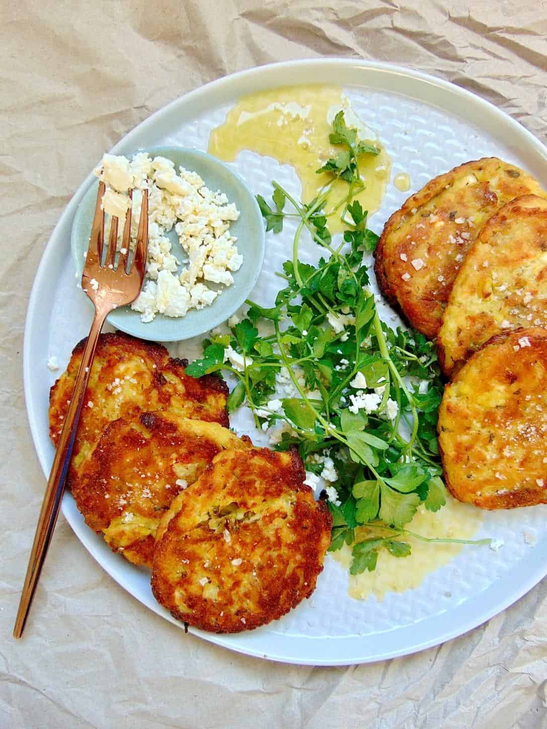  A potato cake that is perfectly crispy on the outside and soft on the inside, with a hint of saltiness from the feta and a pop of freshness from the parsley.