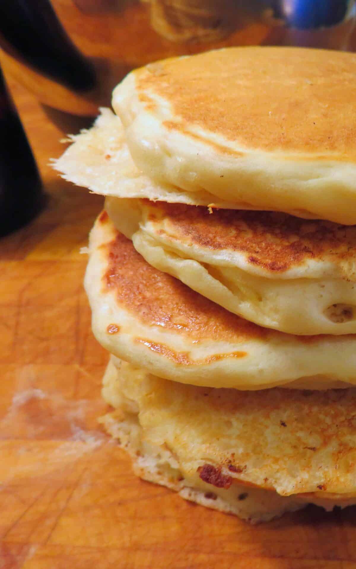  A stack of golden, fluffy, Amish Sourdough pancakes straight off the griddle.