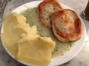  A warm slice of Eastend pie, mash, and liquor.