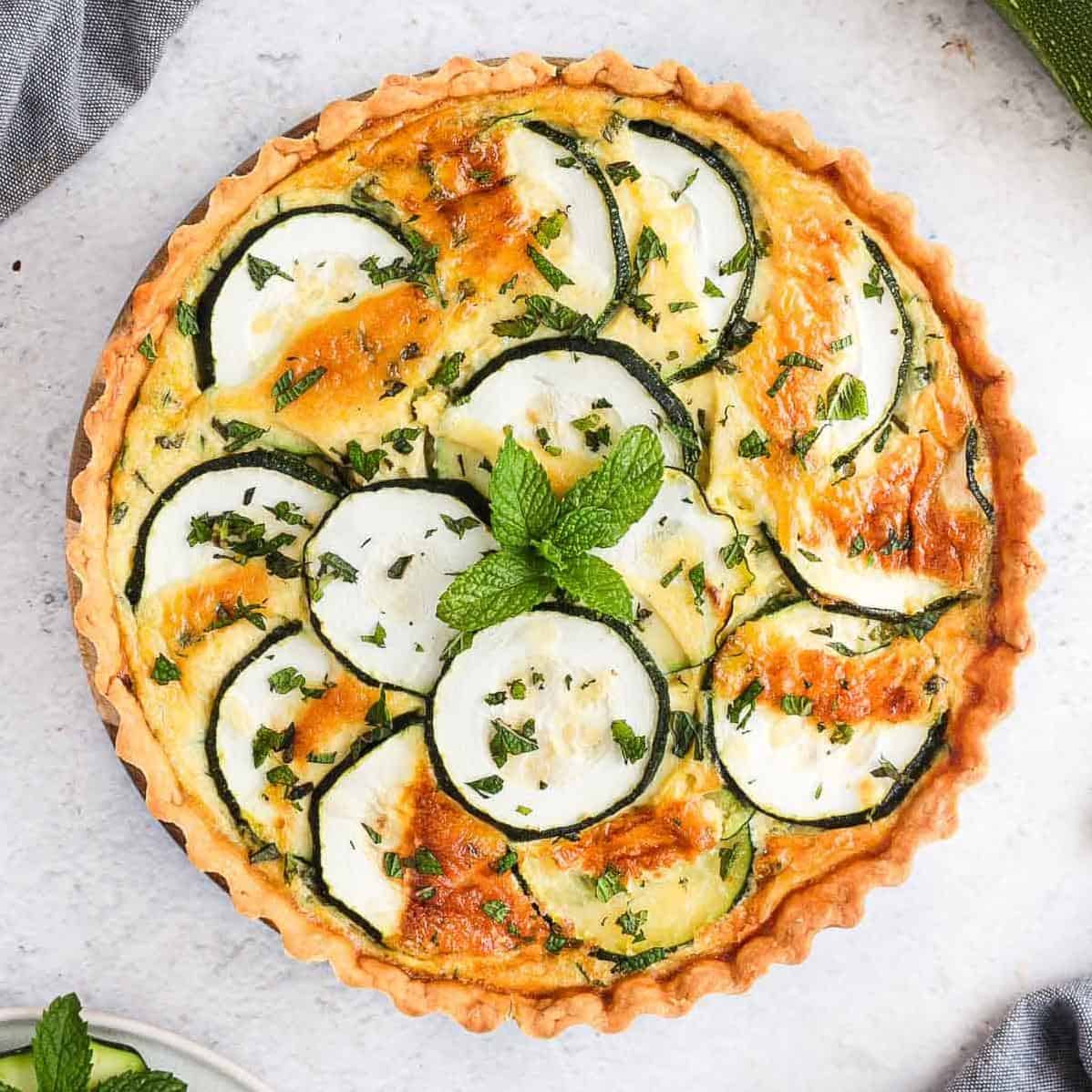  Beautifully arranged zucchini slices on a bed of feta cheese spread