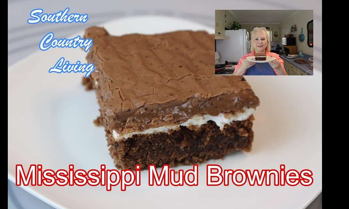 Gooey marshmallows are sprinkled generously on top of the baked brownies, embracing the essence of the Mississippi Mud.