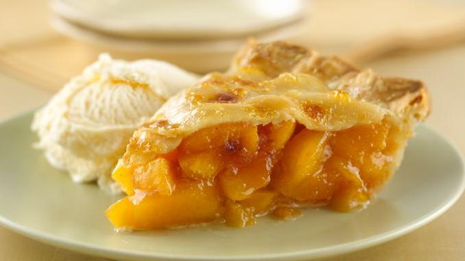  Looking for a unique twist on the classic peach pie? Try this Peacheesy version!