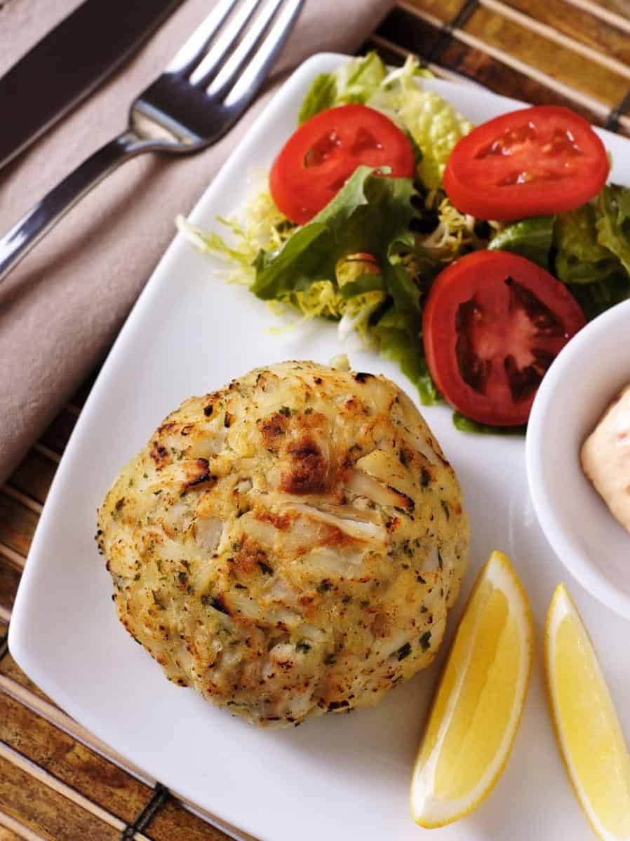  Make a delicious crab cakes sandwich by stuffing them into brioche buns with lettuce, tomatoes, and tartar sauce