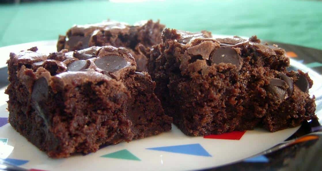  One bite of these scrumptious brownies will transport you to a whole new world of chocolatey goodness.