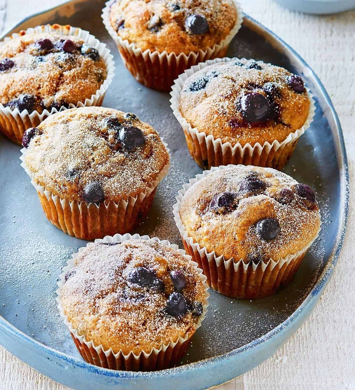   Picture-perfect muffins with perfectly golden tops and colorful berry pieces dotting the insides.