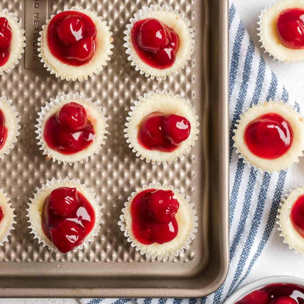  Precious little tarts dusted with a sprinkle of powdered sugar and topped with a bright red cherry