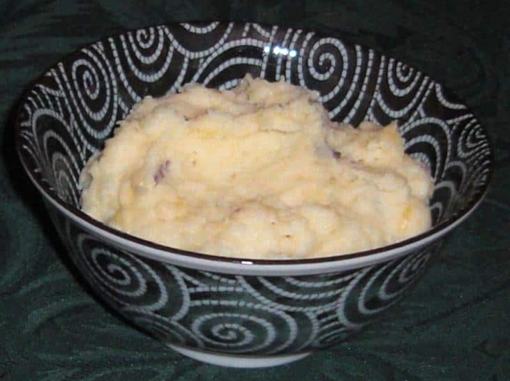  The perfect side dish to elevate any meal, these mashed potatoes are a flavorful masterpiece.