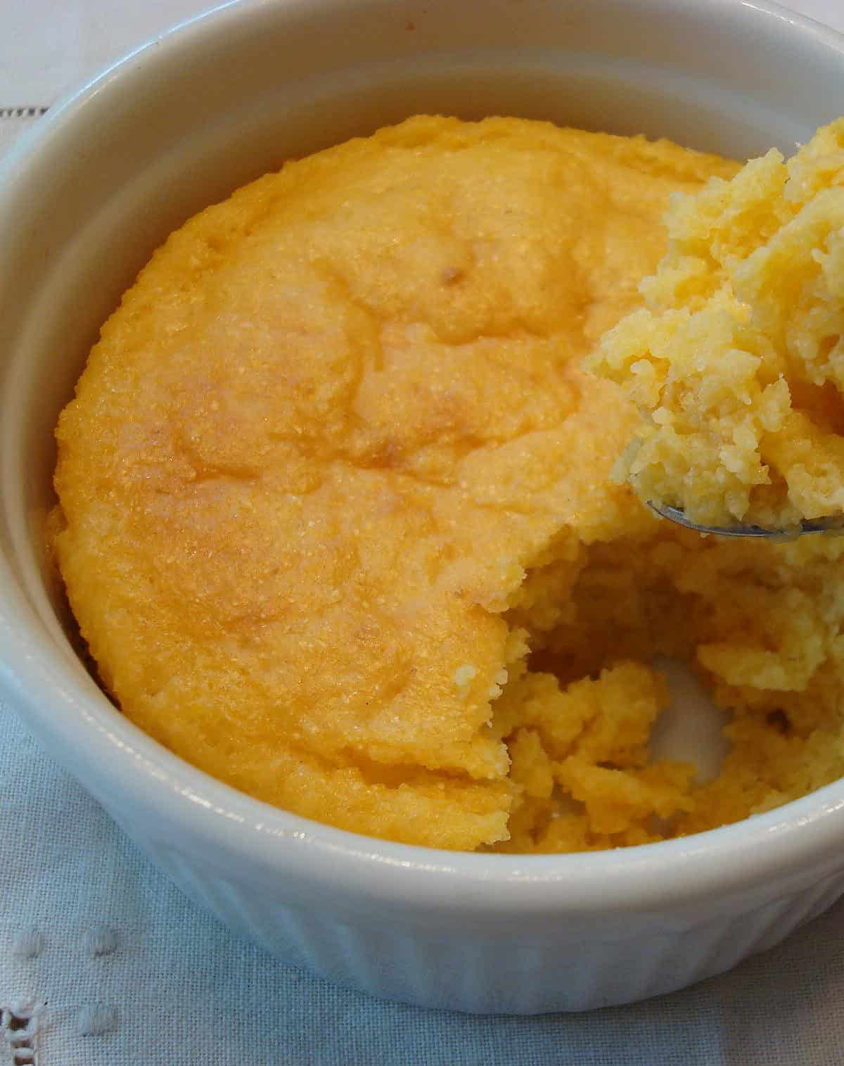  The perfect spoonful of creamy spoon bread with a dollop of butter