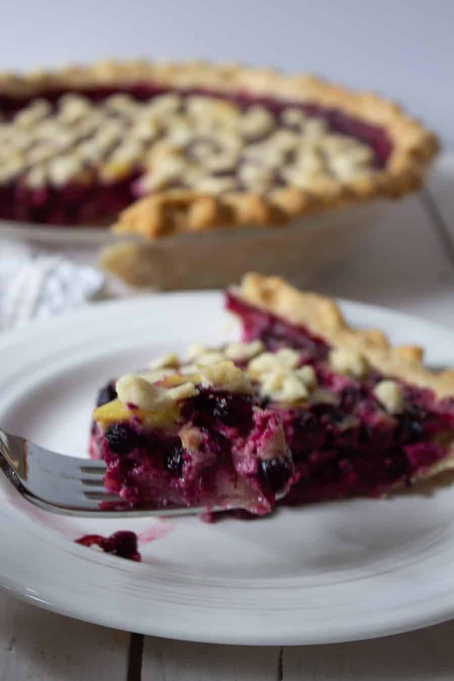  The vibrant colors of fresh berries in a warm and comforting pie.